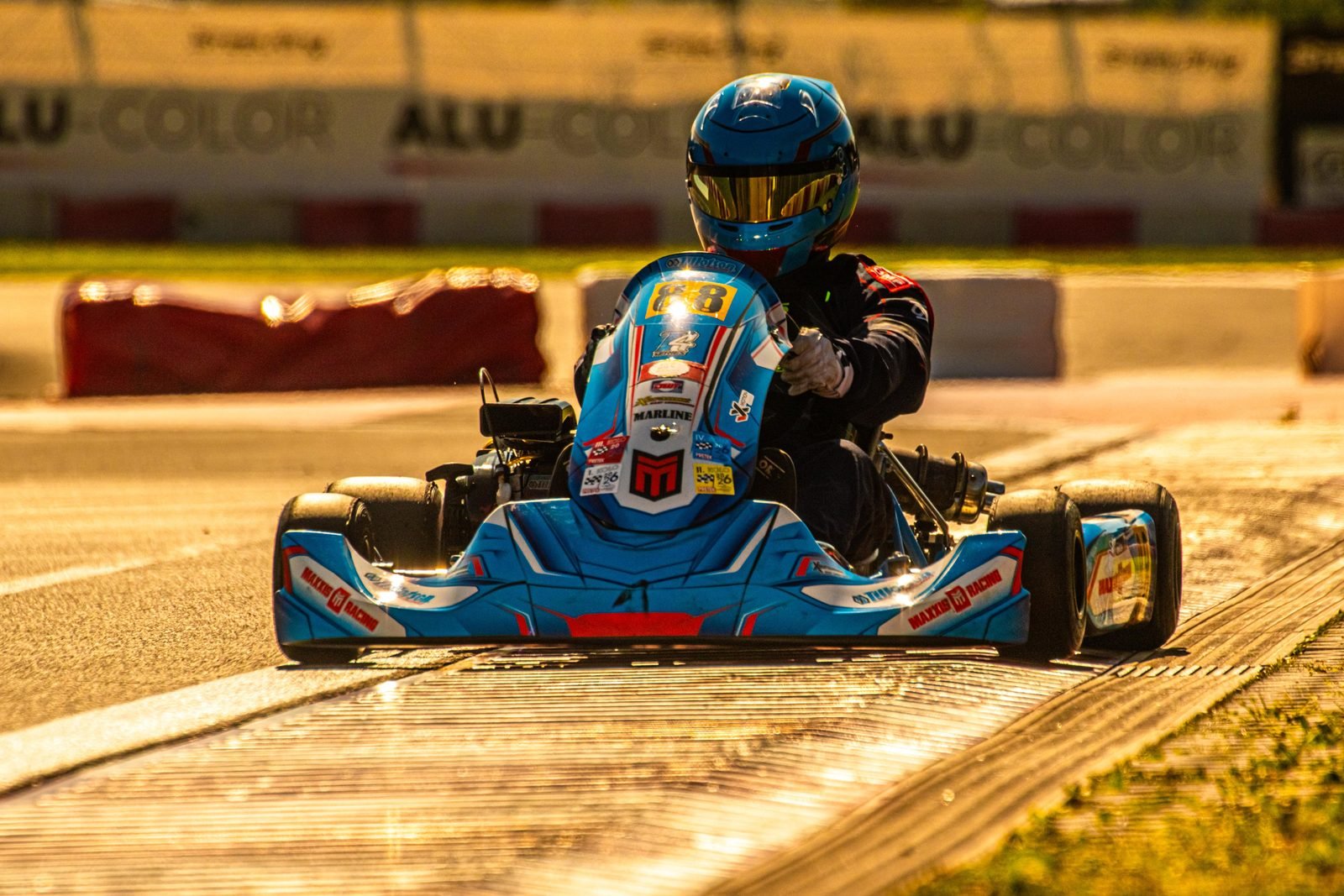 Samuel Uváček on kart number 88 in warm golden light