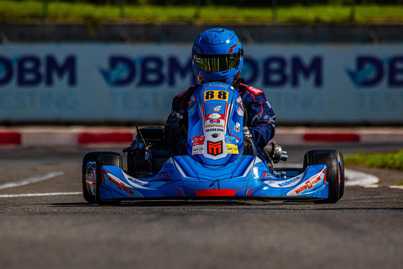 Samuel Uváček in his blue number 88 kart on the straight during a race